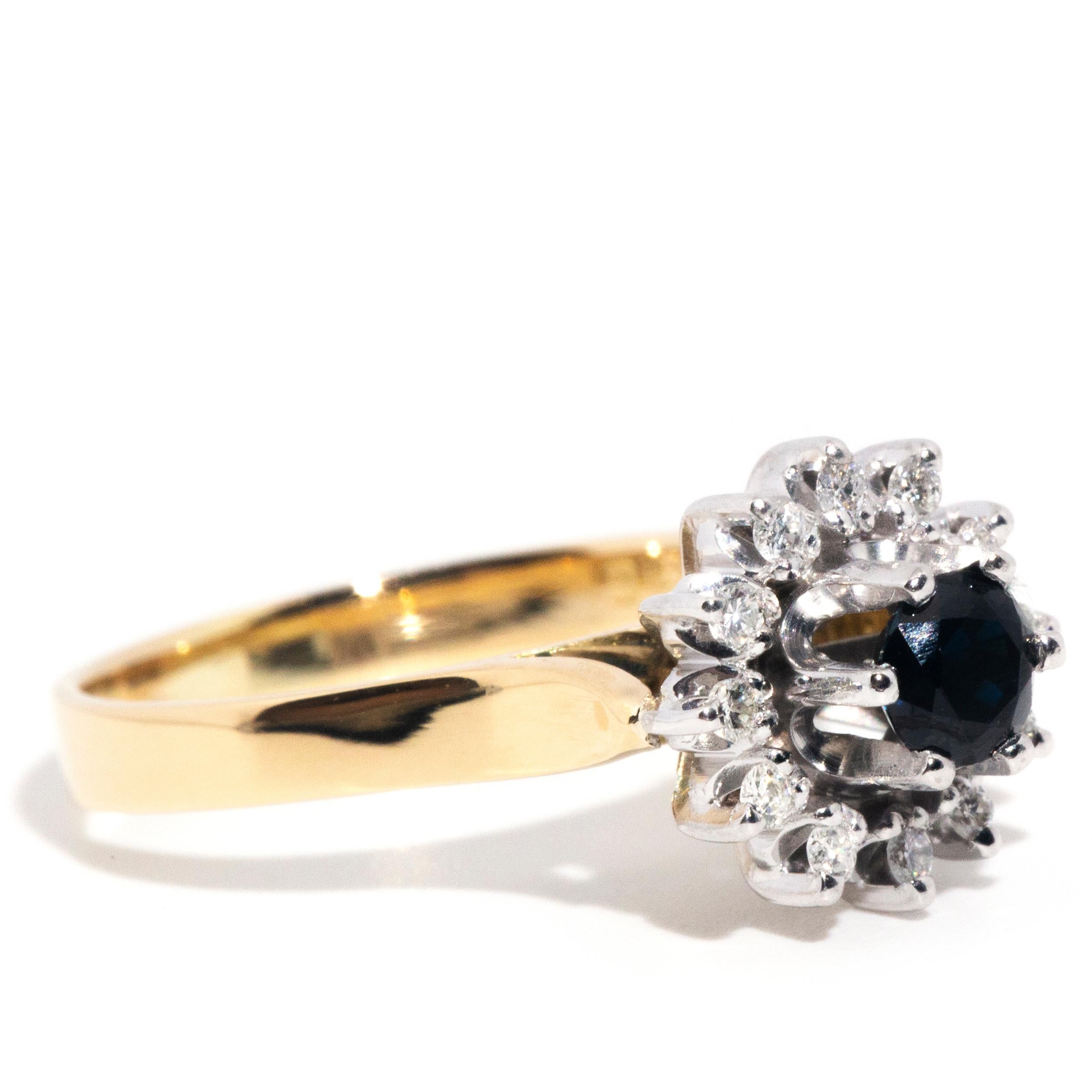 Modern Vintage Circa 1980s 18 Carat Yellow Gold Dark Blue Sapphire & Diamond Halo Ring