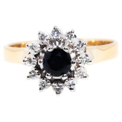 Vintage Circa 1980s 18 Carat Yellow Gold Dark Blue Sapphire & Diamond Halo Ring