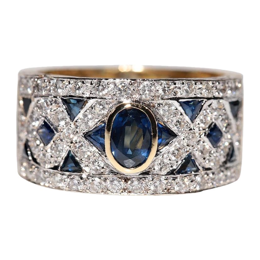 Anello d
oro 18 carati d
epoca, circa anni
80, con diamanti naturali e zaffiri, realizzato a mano