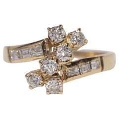 Anillo vintage de oro de 18 quilates de los años 80 con diamantes naturales talla baguette y talla brillante