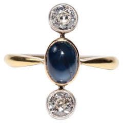 Anillo vintage circa años 80 de oro de 18k con diamante natural y zafiro cabujón