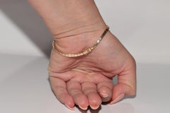 Vintage Circa 1980s 18k Gold Natural Diamond And Caliber Cut Ruby Bracelet
