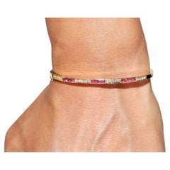 Pulsera vintage circa años 80 de oro de 18 quilates con diamantes naturales y rubíes talla calibre