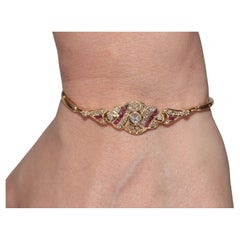 Vintage Circa 1980s 18k Gold Natural Diamond And Caliber Cut Ruby Bracelet