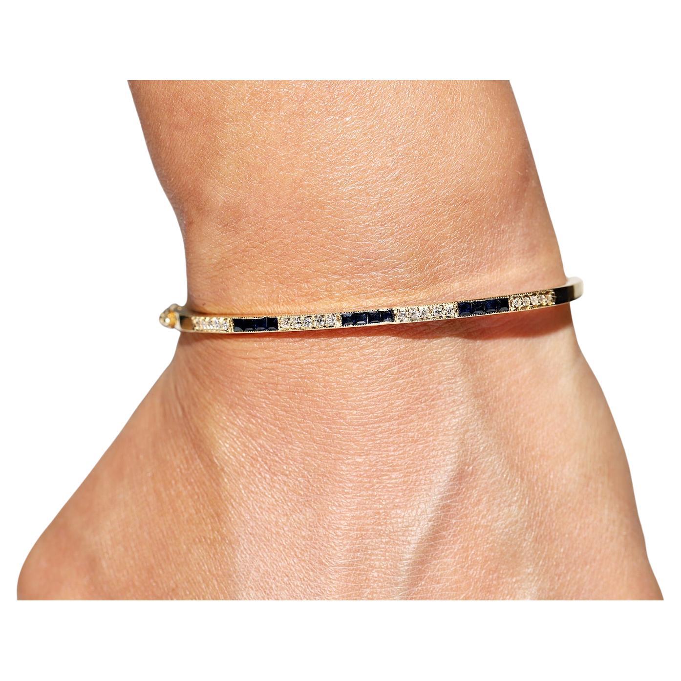 Armband aus 18 Karat Gold mit natürlichen Diamanten und Saphiren im Kaliberschliff, ca. 1980er Jahre