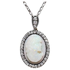 Collana con ciondolo decorato con diamanti naturali e opali in oro 18k, vintage, anni '80 circa.