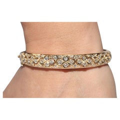Pulsera brazalete fuerte vintage circa años 80 de oro de 18 quilates decorada con diamantes naturales