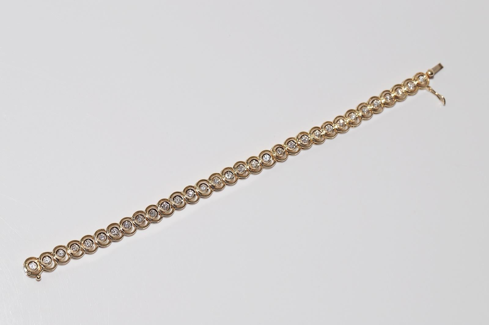 Bracciale da tennis decorato con diamanti naturali in oro 18 ct. d'epoca CIRCA 1980 in vendita 9