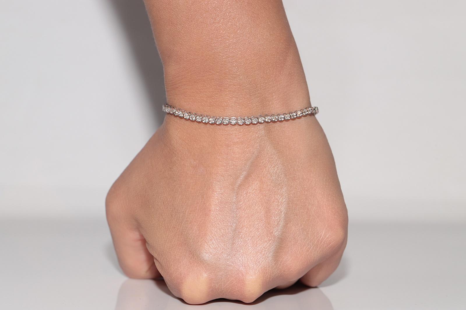 Bracciale da tennis decorato con diamanti naturali in oro 18 ct. d'epoca CIRCA 1980 in vendita 9