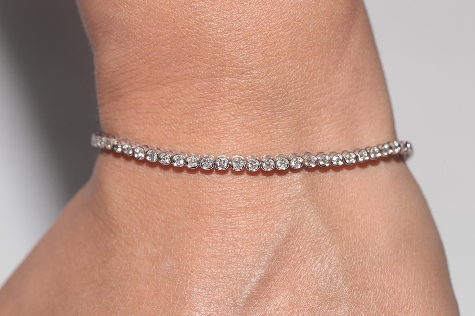 Bracciale da tennis decorato con diamanti naturali in oro 18 ct. d'epoca CIRCA 1980 in vendita 10