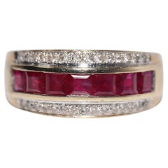 Anillo vintage circa años 80 de oro de 9k con diamante natural y rubí talla baguette