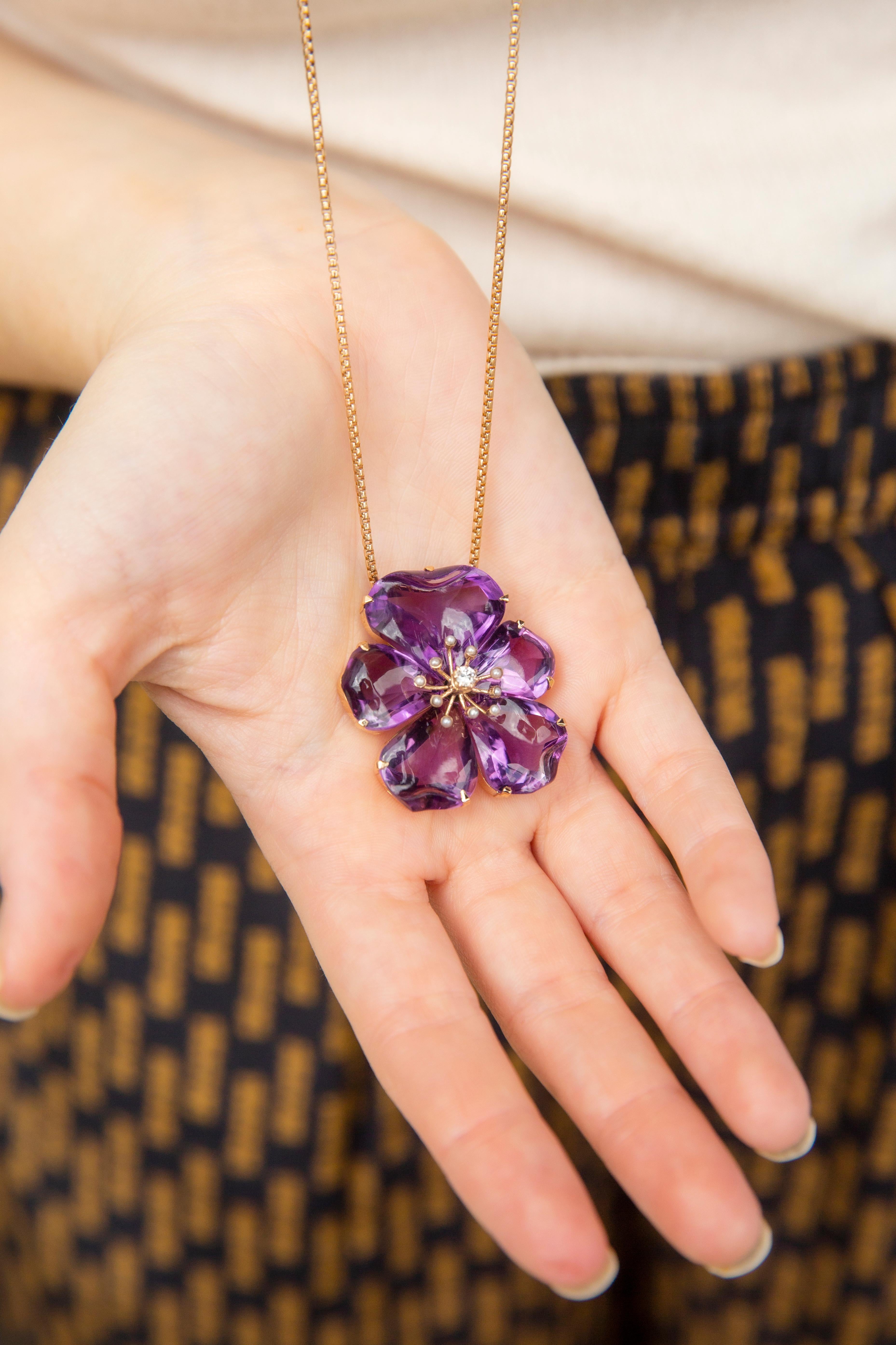 Winter comes, her icy breath blanketing the land,
Life yields, surrendering to frigid months ahead,
One remains, perfect in her gentleness,   
Purple hues evoking memories of warm summers.

The 14 carat gold Arabella is fitted with a 9 carat gold