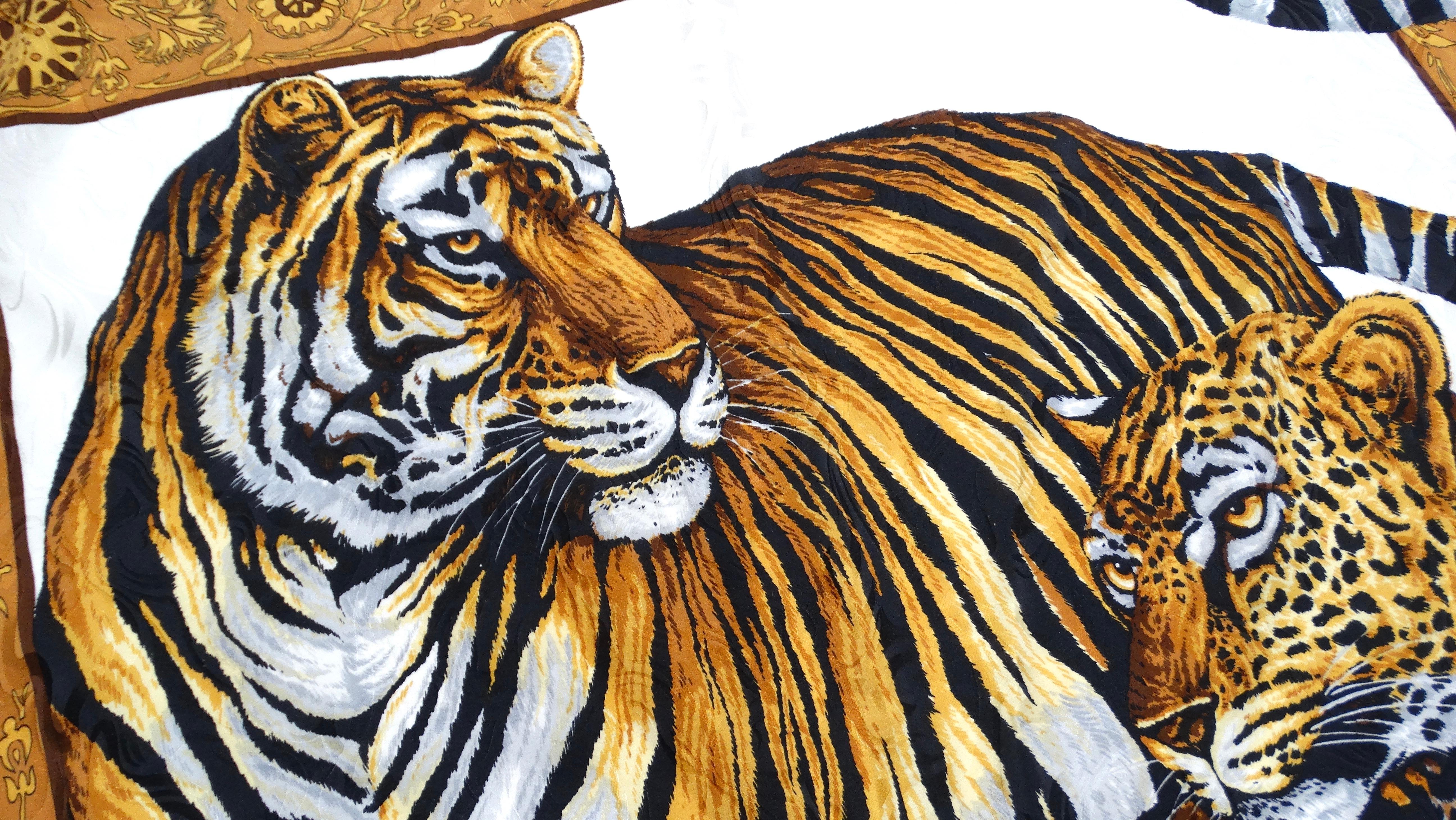 Indulge in the exotic allure of this Vintage Circa 1980s Leopard & Tiger Motif Silk Scarf, a remarkable statement piece that showcases the elegance and vibrancy of the jungle. Featuring striking depictions of majestic big cats framed within a