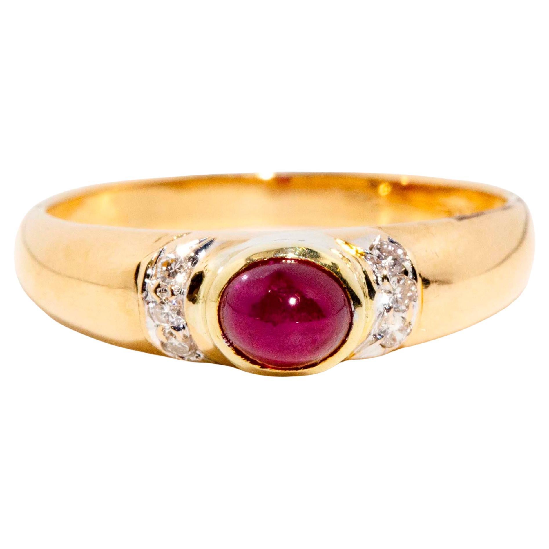 Vintage Circa 1980s Oval Ruby Cabochon & Diamond Ring 18 Carat Yellow Gold For Sale