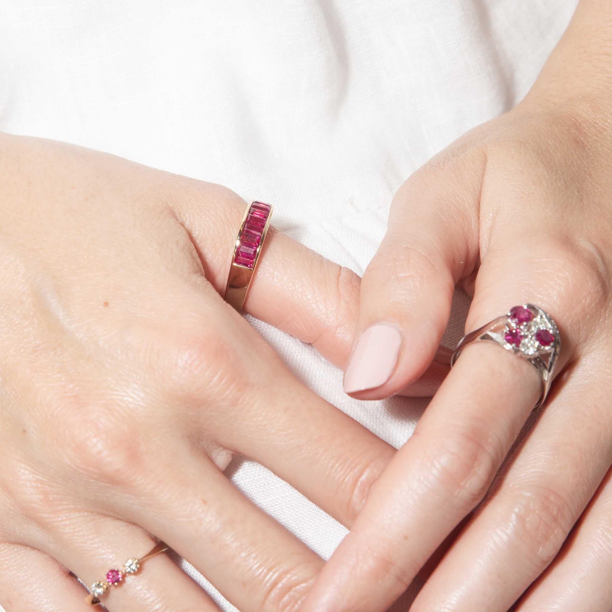 Crafted with crimson rubies and rich 18 carat yellow gold, our Marcia Ring is a gorgeous jewel.  A beautiful addition to your vintage collection of quality sparkle.
 
The Marcia Ring Gem Details
The bright red baguette cut rubies are estimated to