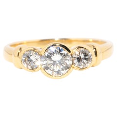 Vintage Circa 1990s 18 Carat Yellow Gold Three Stone Brilliant Diamond Ring