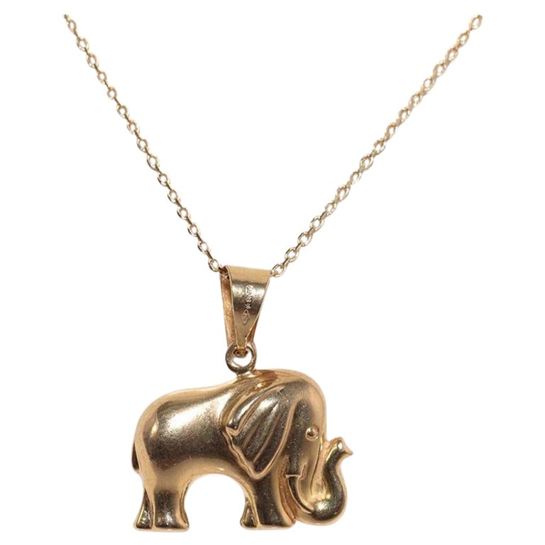 Collana con ciondolo decorato a forma di elefante in oro 18k, vintage, anni
90 circa.