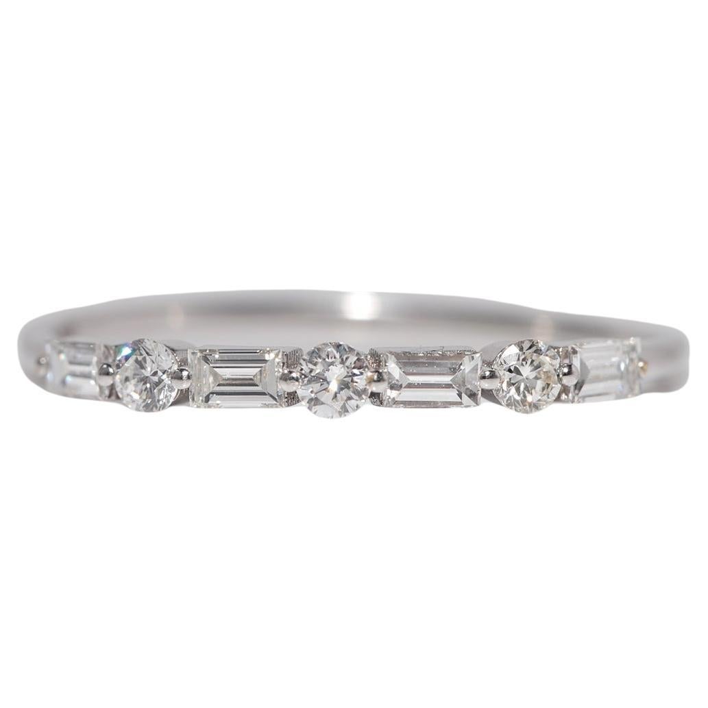 Anello Vintage CIRCA anni
90 in oro 18k con diamante naturale taglio Brilliante e Baguette