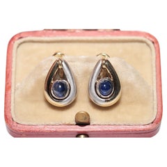 Vintage des années 1990, or 18 carats, saphir naturel cabochon taille cabochon  Boucle d'oreille