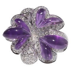 Anello vintage degli anni
90 in oro 18k con diamante naturale e ametista tagliata a cabochon