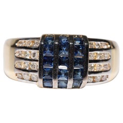 Anello d
oro 18k con diamanti naturali e zaffiri taglio calibro, vintage, anni
90 circa.