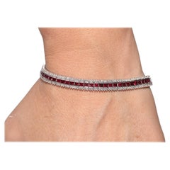 Pulsera vintage circa años 90 de oro de 18 quilates decorada con diamantes naturales y rubíes naturales