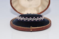 Pulsera vintage de los años 90, de oro de 18 quilates, decorada con diamantes naturales y rubíes