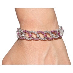 Bracciale da tennis decorato con diamanti naturali e rubini in oro 18 carati, vintage, anni '90 circa.