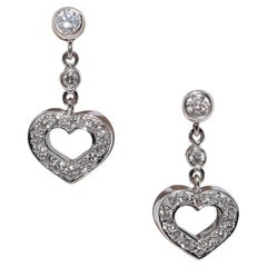 Vintage By, anni 
90, orecchino in oro 18k con diamante naturale decorato a forma di cuore