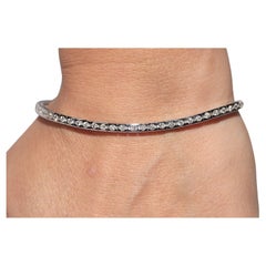 Pulsera de tenis vintage circa años 90 de oro de 18 quilates decorada con diamantes naturales