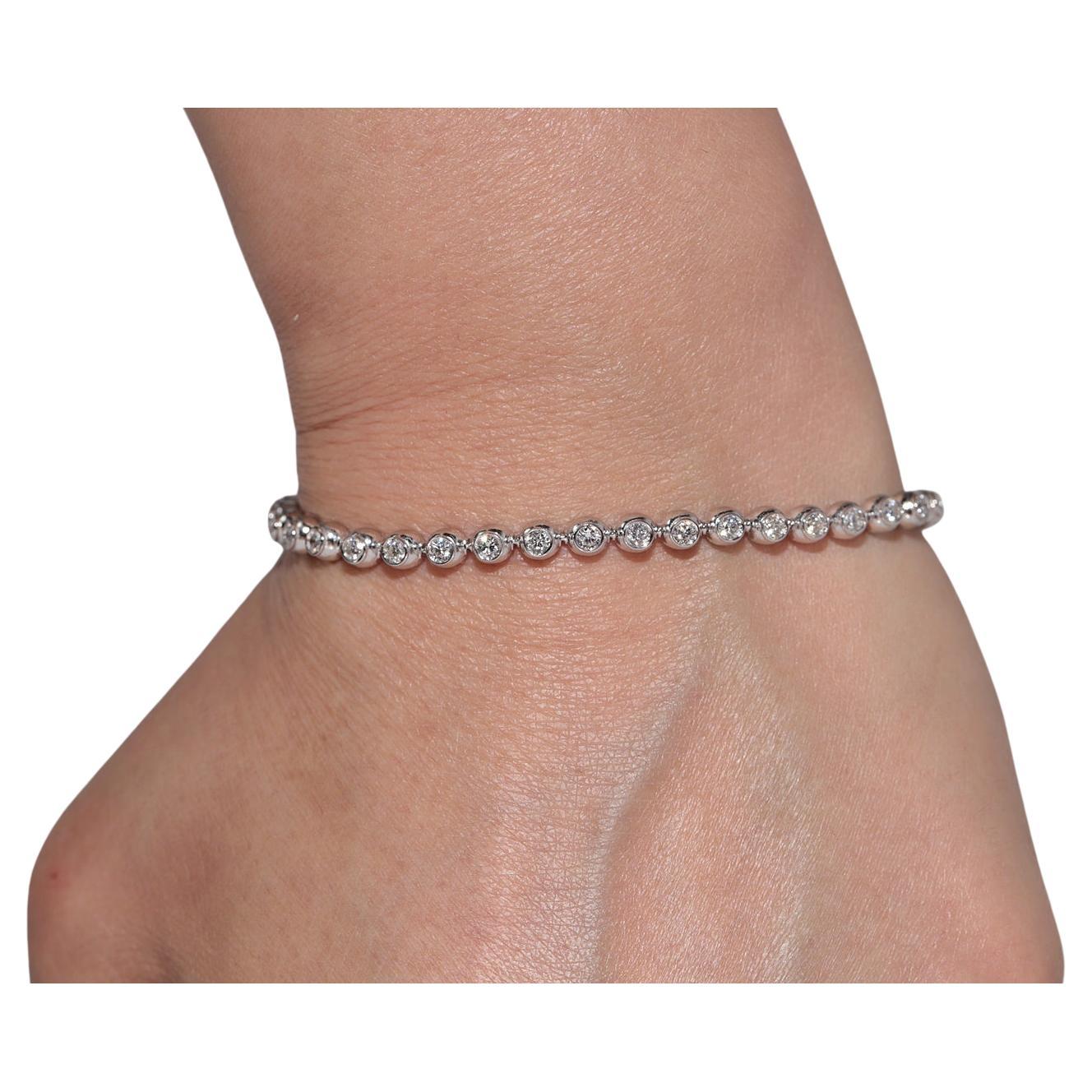 Pulsera de tenis vintage circa años 90 de oro de 18 quilates decorada con diamantes naturales