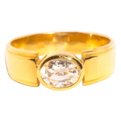 Vintage Circa 1990s 22 Carat Yellow Gold Rubover Set Oval White Sapphire Ring