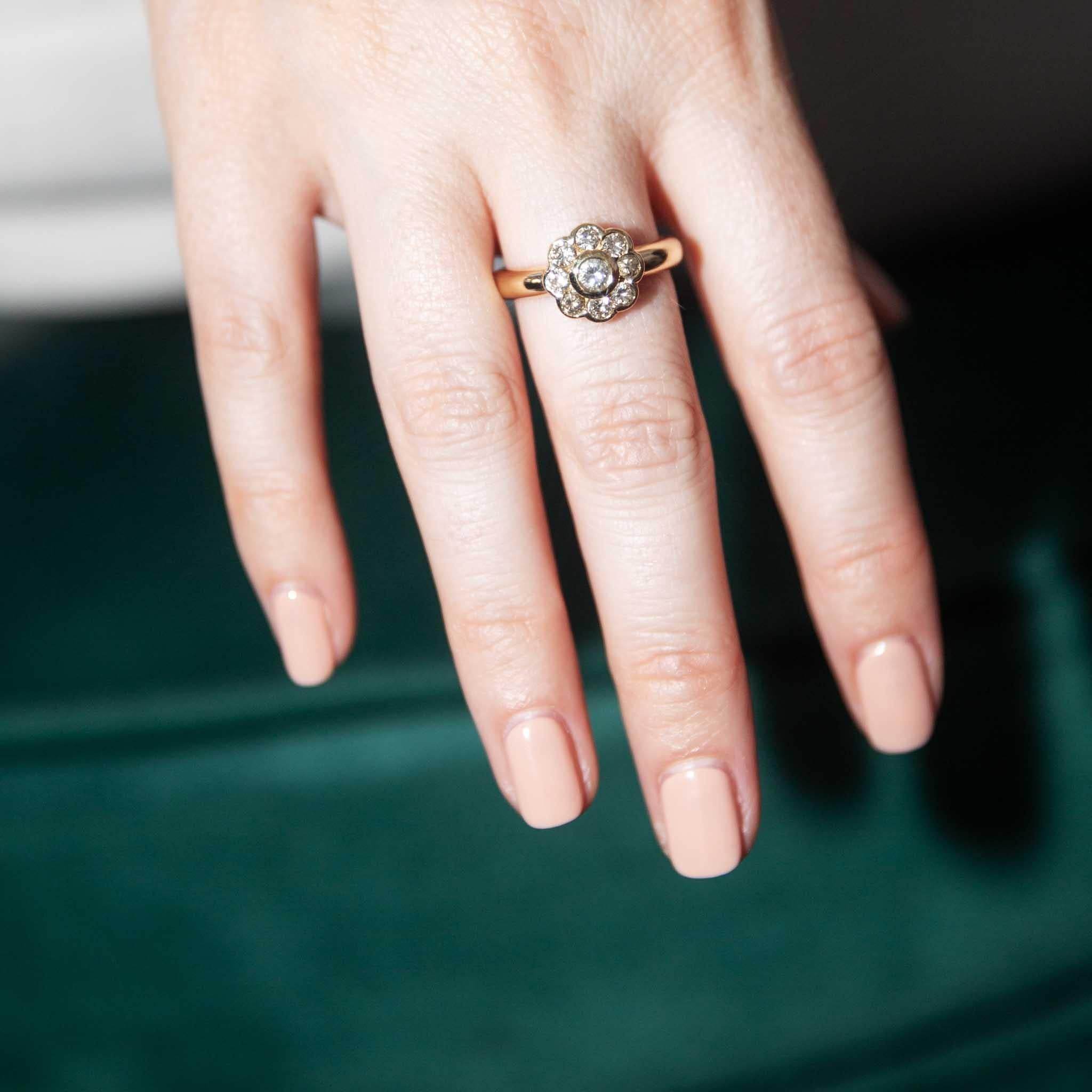 Our Velma Ring is an 18 carat gold vision. With her sparkling diamonds set in a 'Daisy' cluster, she is a stunning and impactful accessory.  A ring to be added to your family history for generations to come. 

The Velma Ring Gem Details
The round