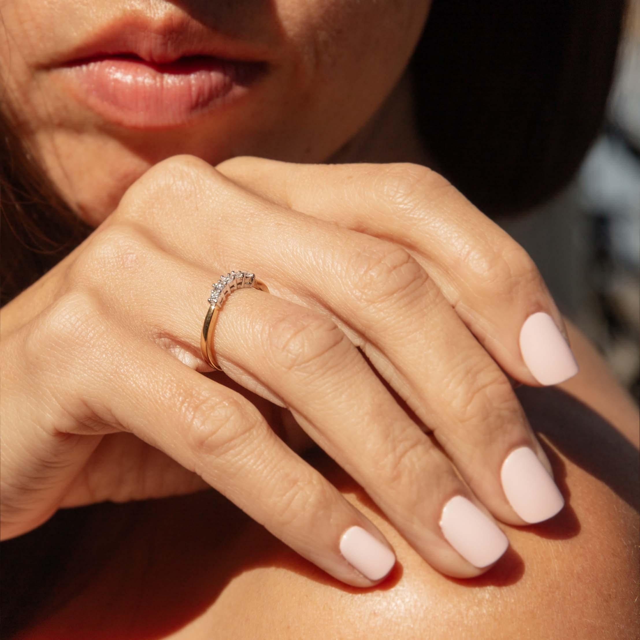 Embrace the allure of the 1990s with this stunning Ariel Diamond Curved Eternity Stacking Ring, expertly crafted in rich 18 carat yellow gold. Each brilliant diamond captures light like a whisper, symbolizing everlasting love and commitment.
