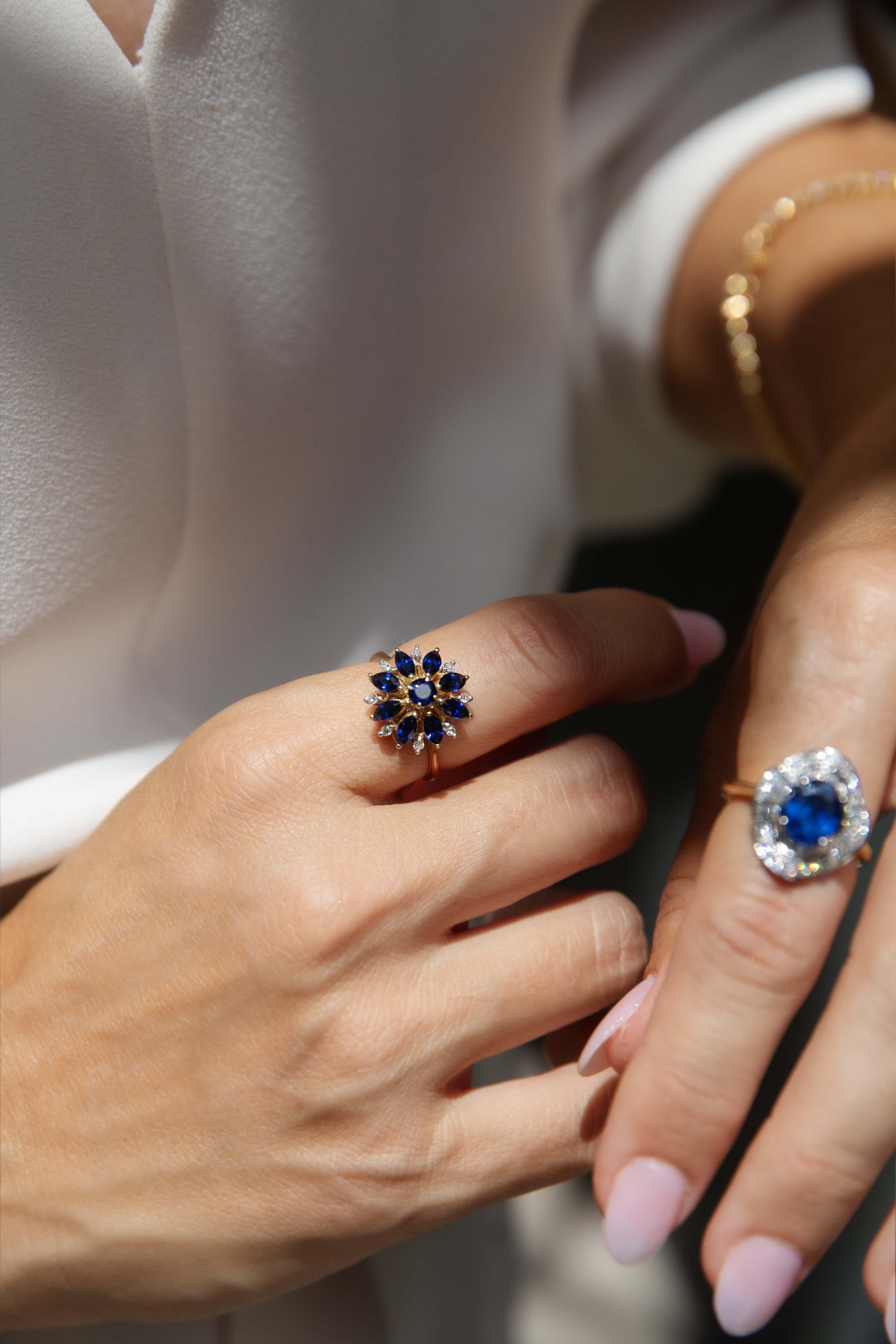 A dazzling bloom of deep blue sapphires and sparkling diamonds, the14 carat gold Cairo Ring radiates timeless charm. The intricate cluster design evokes the elegance of vintage floral motifs, while its rich gold setting enhances the brilliance of