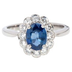 Vintage Circa 1990s Oval Blue Sapphire & Diamond Halo Ring 18 Carat White Gold