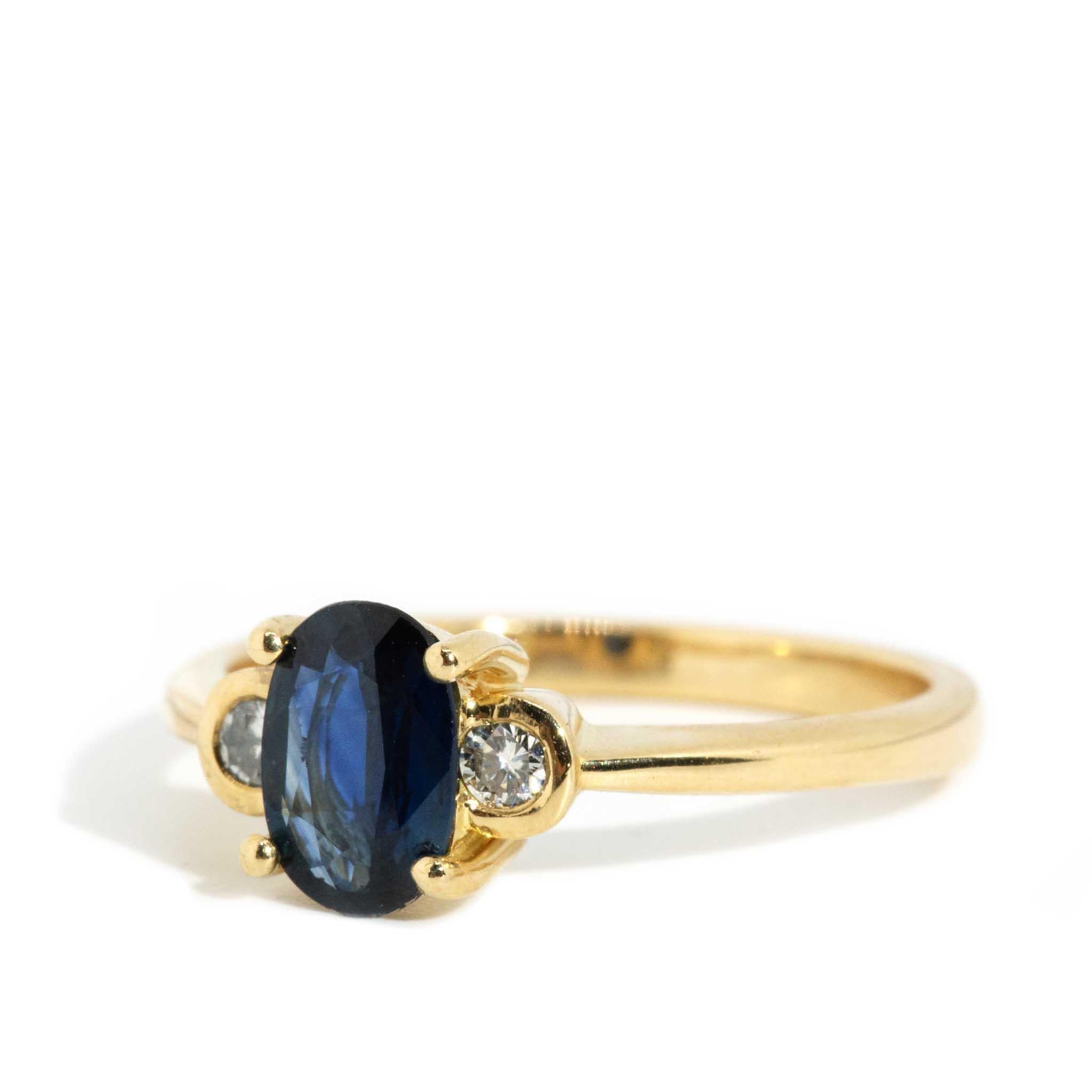 Oval Cut Vintage Circa 1990s Oval Deep Blue Sapphire & Diamond Ring 18 Carat Yellow Gold