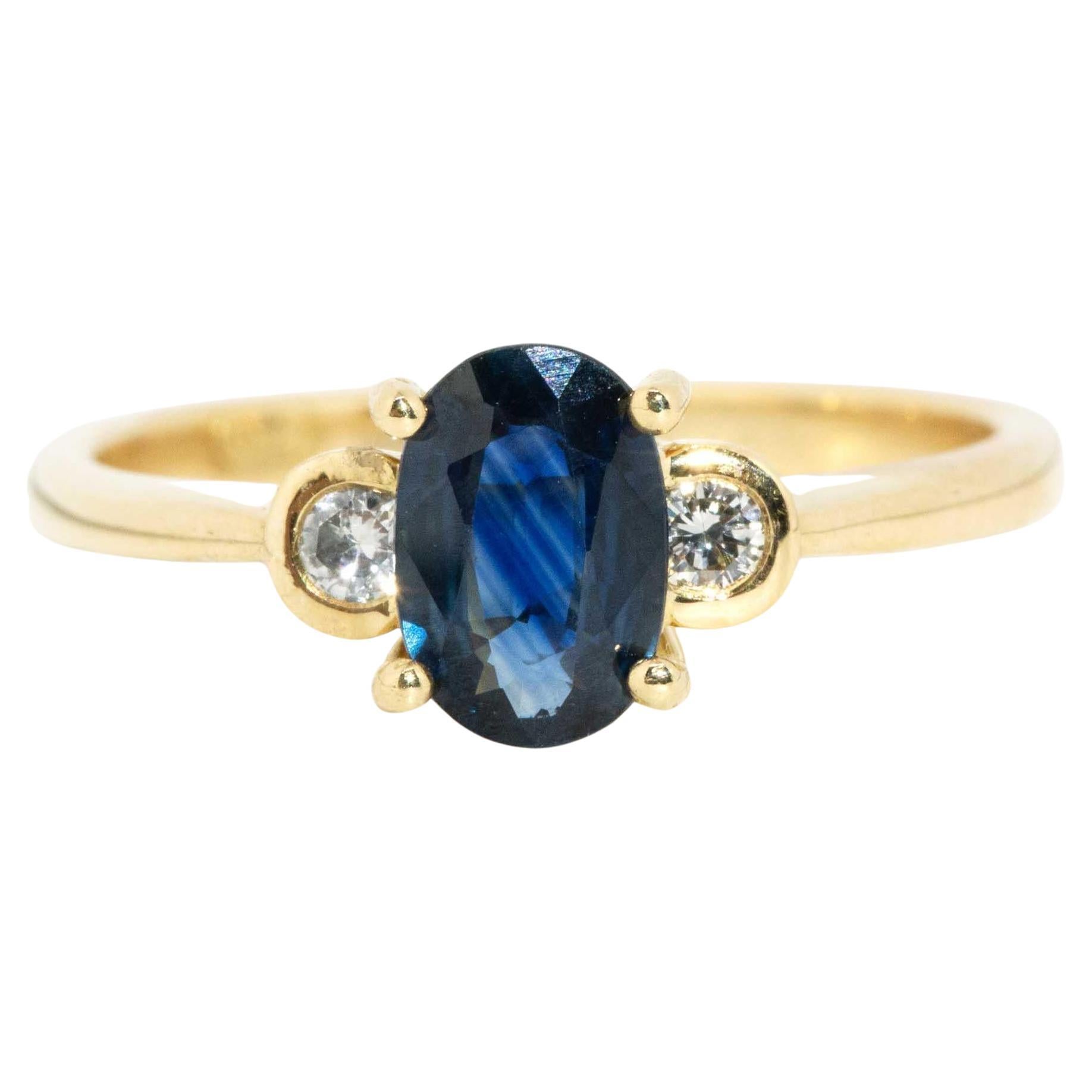 Vintage Circa 1990s Oval Deep Blue Sapphire & Diamond Ring 18 Carat Yellow Gold