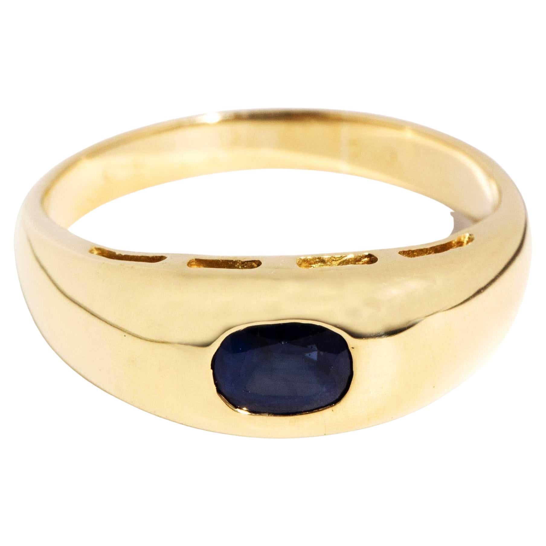 Vintage Circa 1990s Rubover Oval Sapphire Domed Band 18 Carat Yellow Gold For Sale