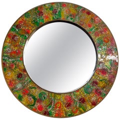 Vintage circulat mirror with a polychrome glass mosaic frame