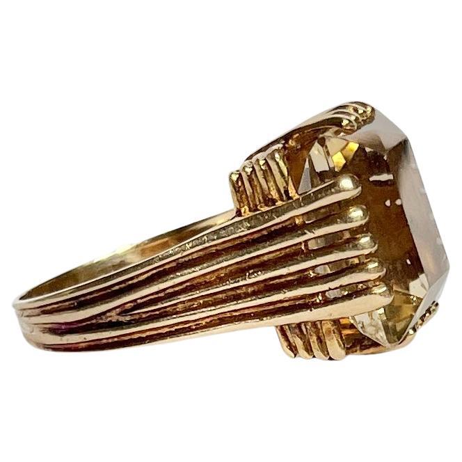 The gorgeous citrine stone is a soft yellow colour set in decorative claws with the detail carrying on don to the band. Modelled in 9carat gold. Hallmarked London 1972.

Ring Size: P or 7 3/4 
Stone Dimensions: 15x12.5mm
Height Off Finger: 10.5mm