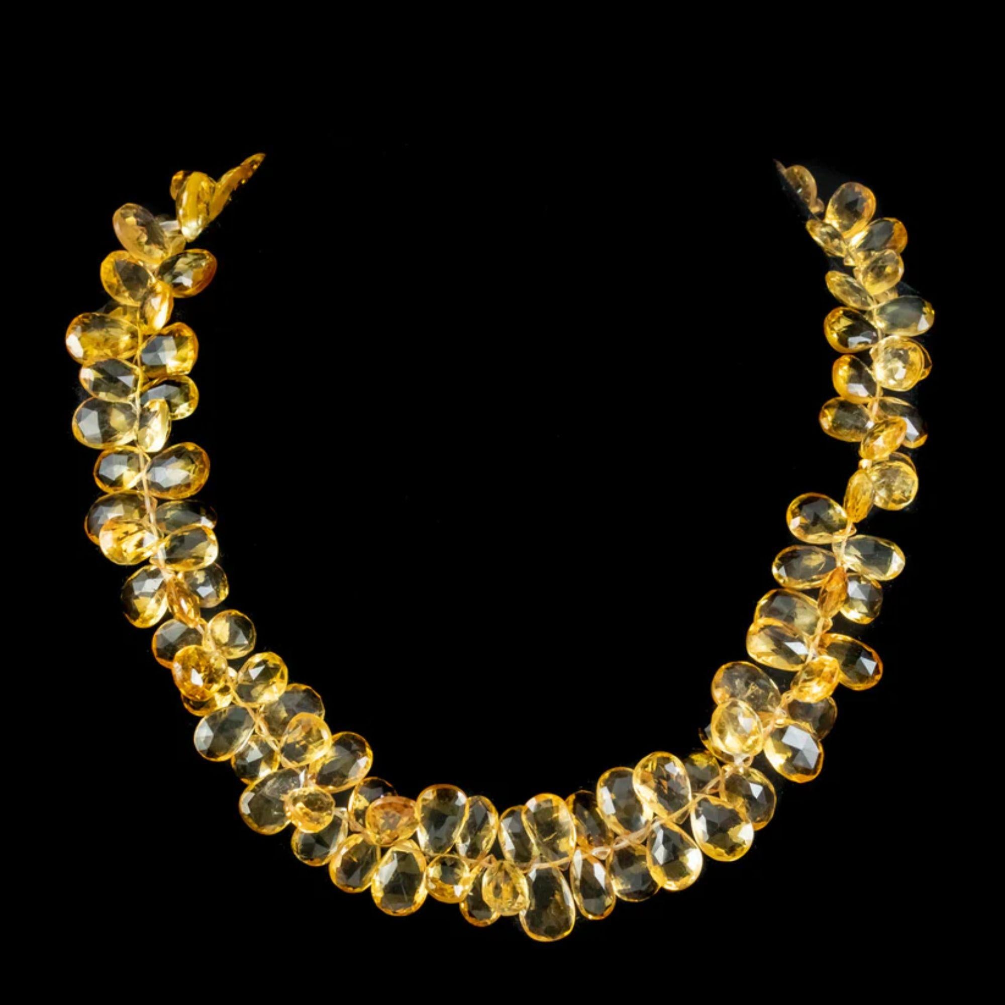 A glorious vintage necklace lined with a dazzling array of briolette cut citrines which have a crisp, radiant quality and golden hue, glowing like sunshine from within. The smallest is approx. 1.70ct and graduate in size to larger 4ct stones. 

It’s