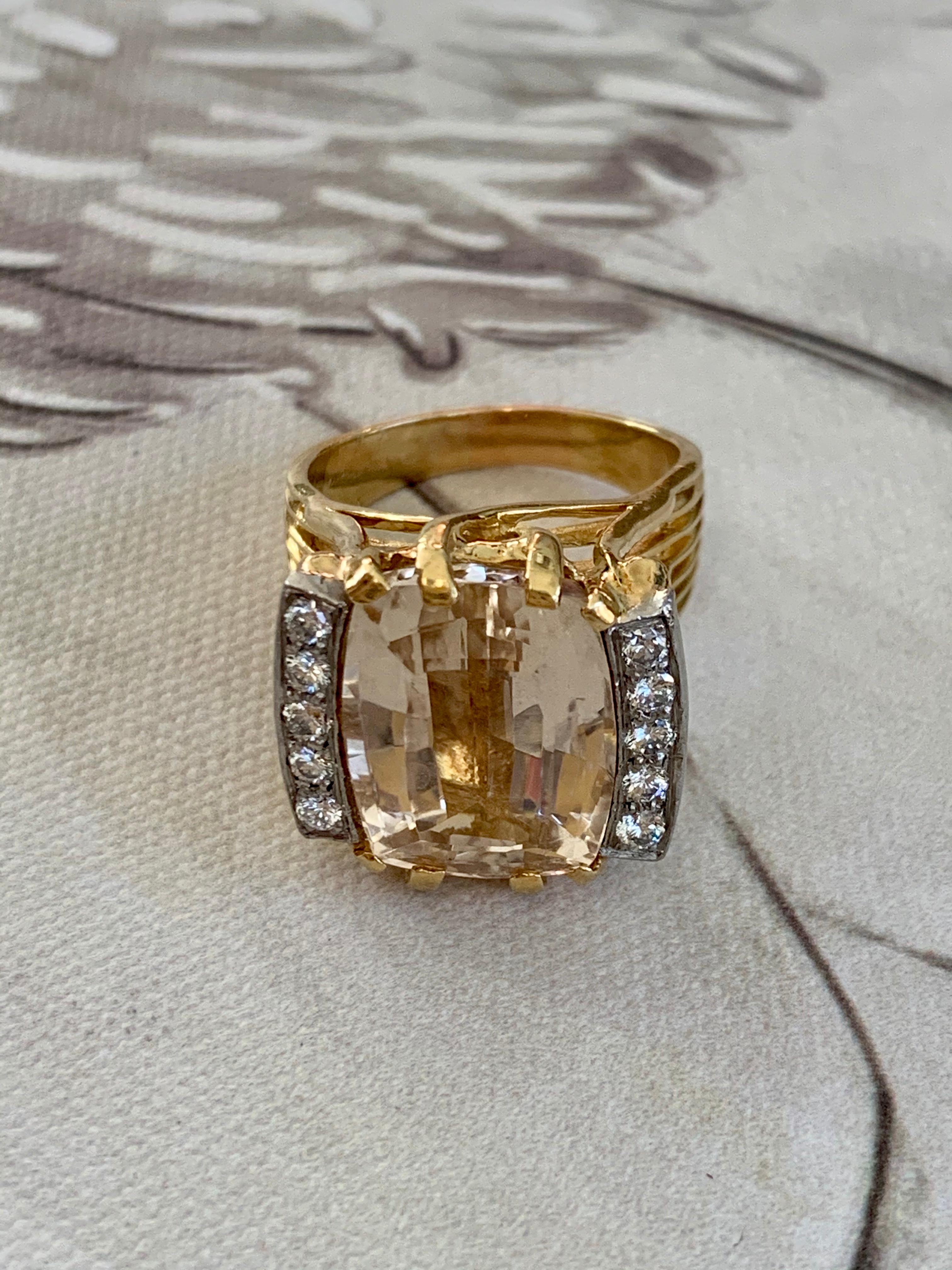 Wow!  This ring is stunning!  It features one cushion cut Citrine, which is surrounded by five Diamonds on each side.  Diamonds equal .40ctw with grades VS-G.

Size: 9 1/4
Weight: 16.5 grams