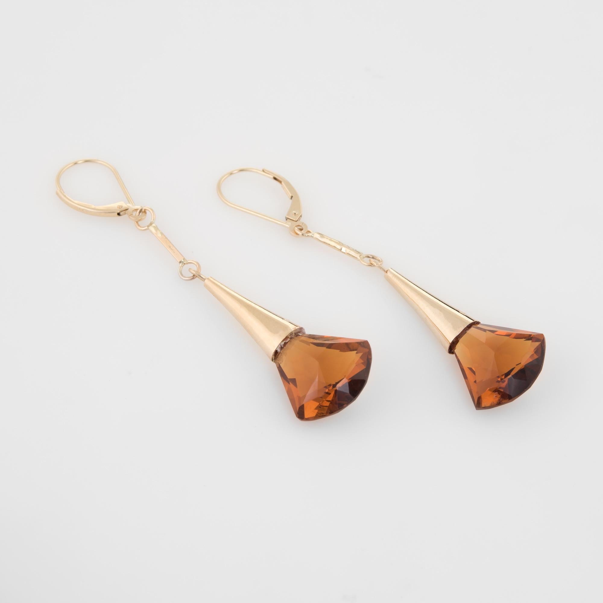 Finely detailed pair of vintage citrine drop earrings, crafted in 14k yellow gold. 

Two citrines measure 13mm x 15mm. The citrines are in excellent condition and free of cracks or chips.  

The charming earrings are set with citrines that offer a
