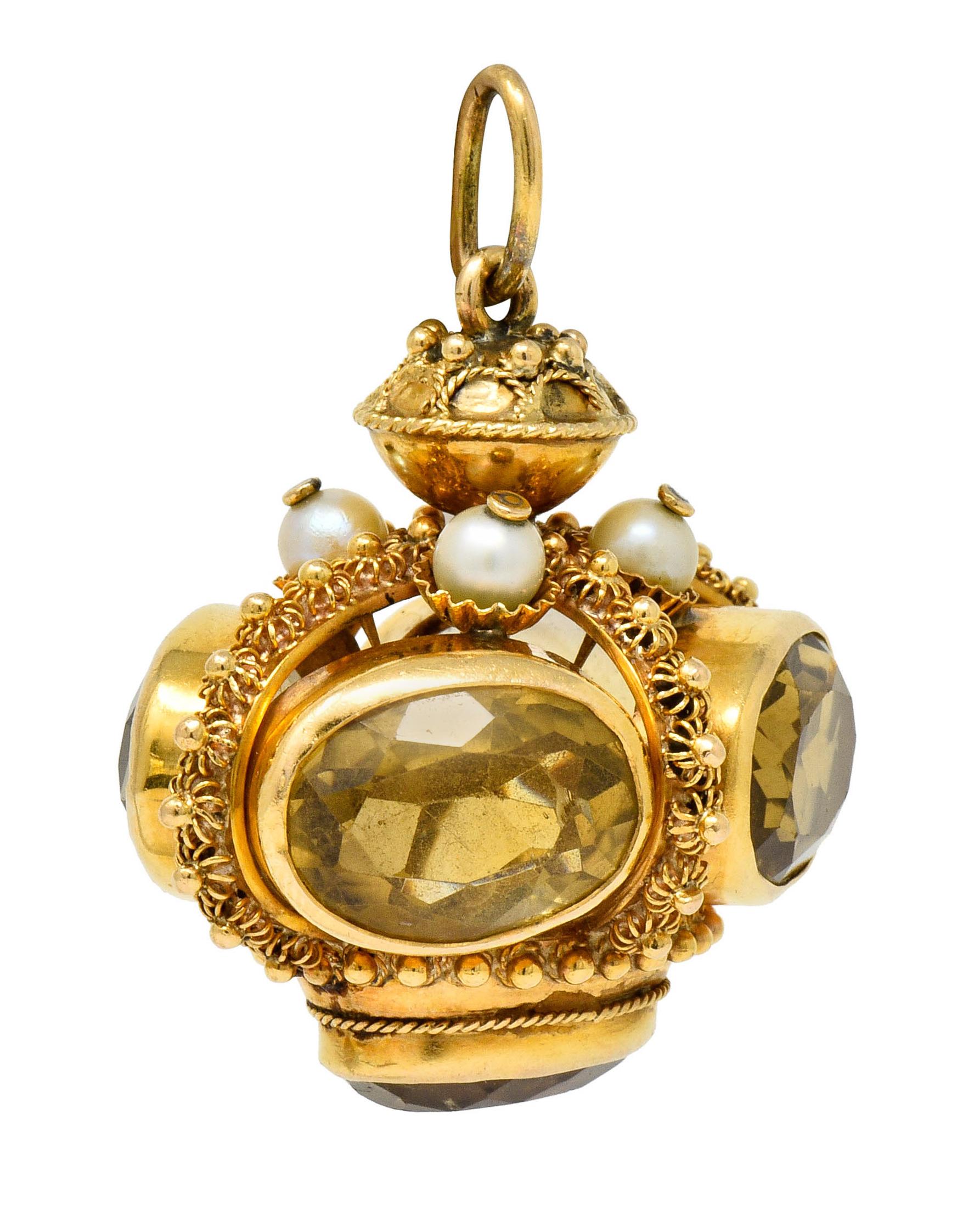 Designed as a crown-like form with four curved arches; decorated throughout by caged florals, polished gold beads, and a draped twisted rope motif

Featuring five oval cut citrine, bezel set, measuring approximately 15.0 x 11.2 mm; transparent and a