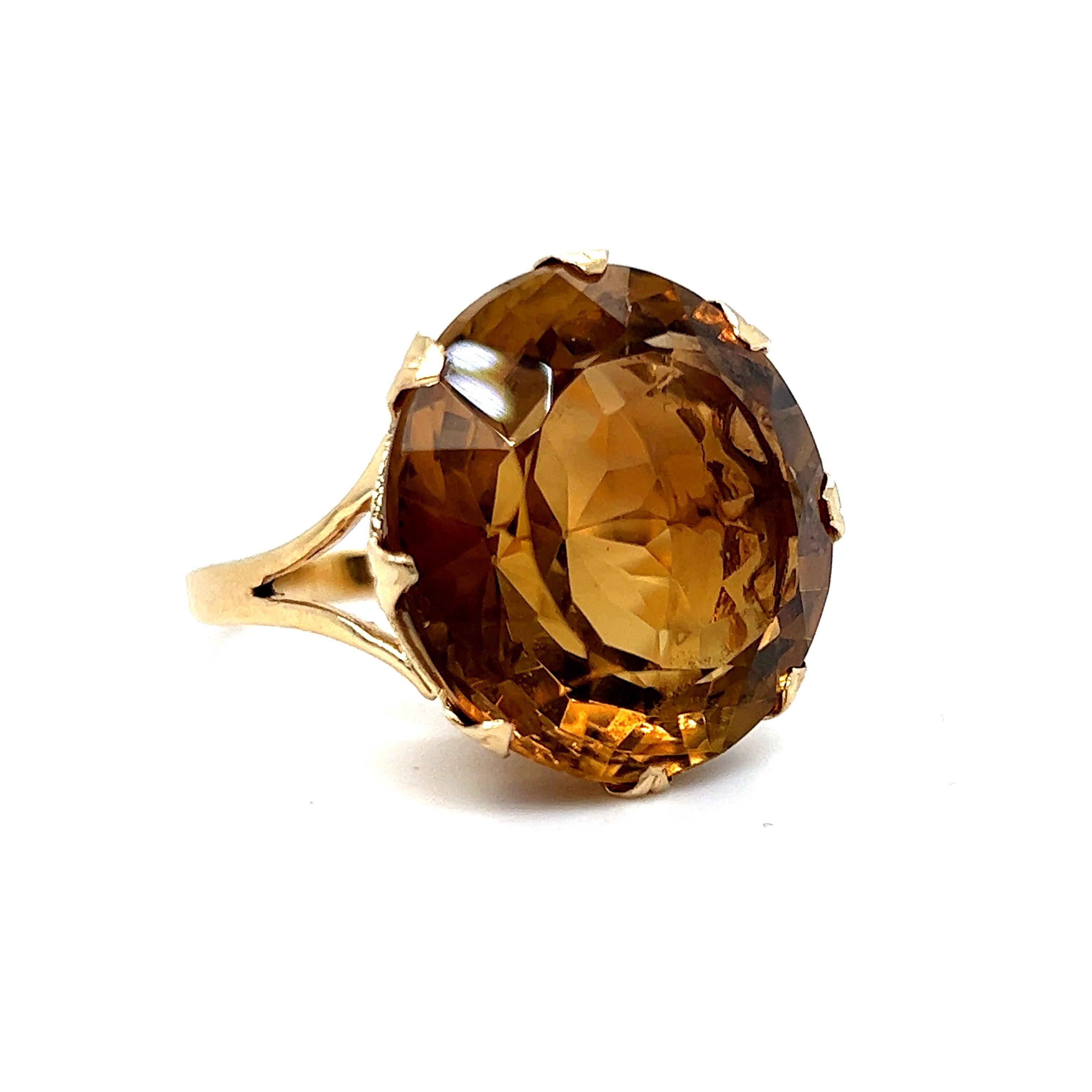 This Vintage Citrine Ring is just fantastic! Crafted in 14K Yellow Gold, this piece really brings the wow factor! The solitaire is a whopping 32 carats, transparent and inclusion free, and of fine quality, set in a detailed basket! One of a kind,