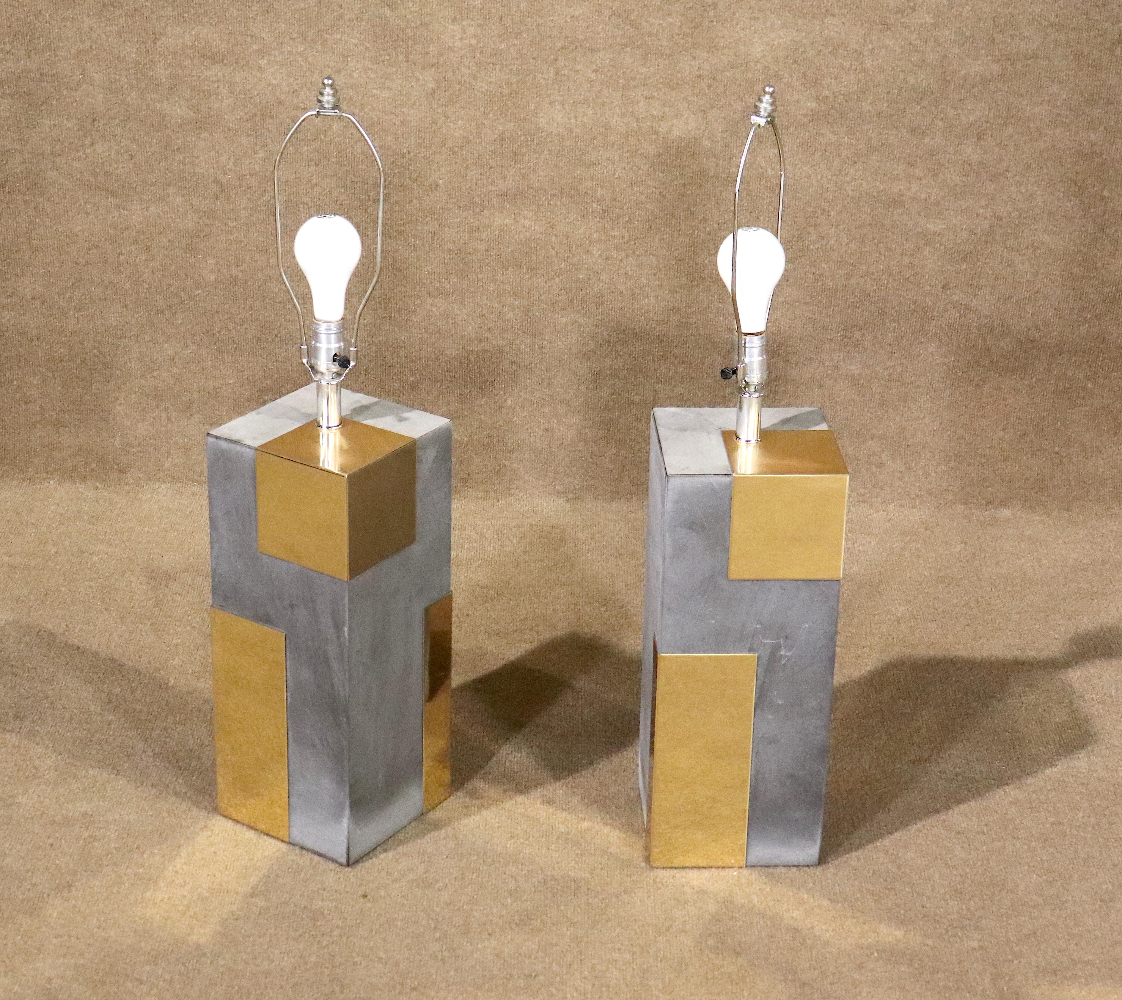 This pair of Paul Evans Cityscape style lamps brings its own mid-century modern flair to the table. Chrome and brass geometric panels reflect the light from each medium base bulb.

Please confirm pickup location, NY or NJ.