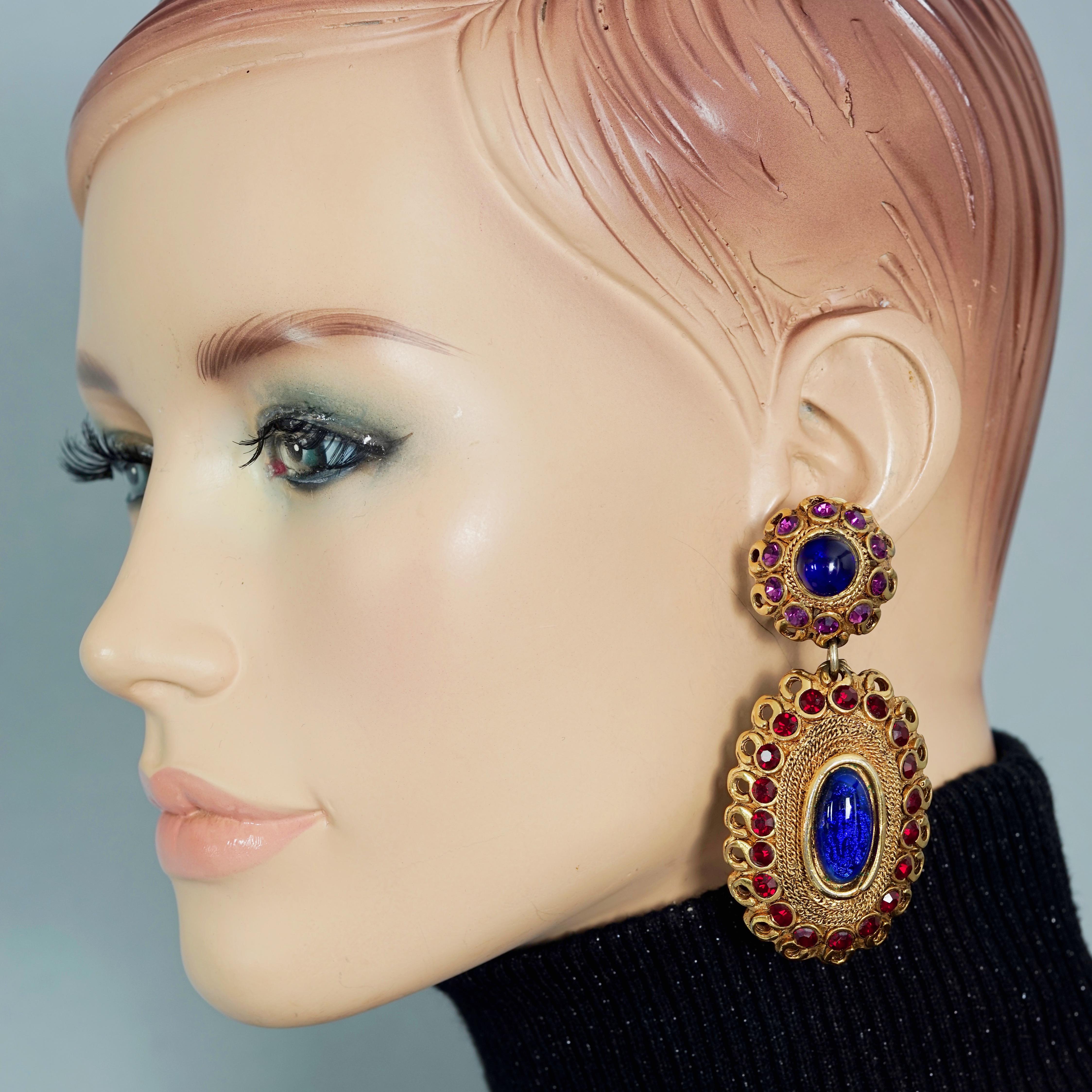 Vintage CLAIRE DEVE Byzantine Glass Cabochon Dangling Earrings

Measurements: 
Height: 3.54 inches (9 cm)
Width: 1.38 inches (3.5 cm)
Weight per Earring: 23 grams

Features:
- 100% Authentic CLAIRE DEVE.
- Large Byzantine style dangling earrings