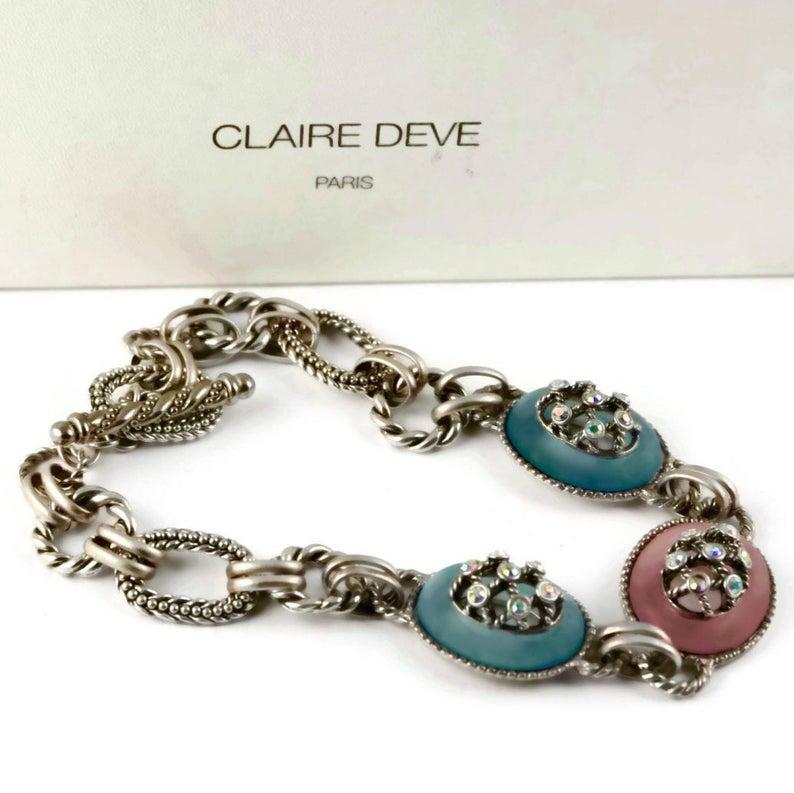 Vintage CLAIRE DEVE Chunky Pastel Charm Rhinestones Necklace

Measurements:
Height: 1 3/8 inch (3.49 cm)
Wearable Length: 18 2/8 inches (46.35 cm)

Features:
- 100% Authentic CLAIRE DEVE.
- Chunky chain with pastel oval resin centrepiece.
-