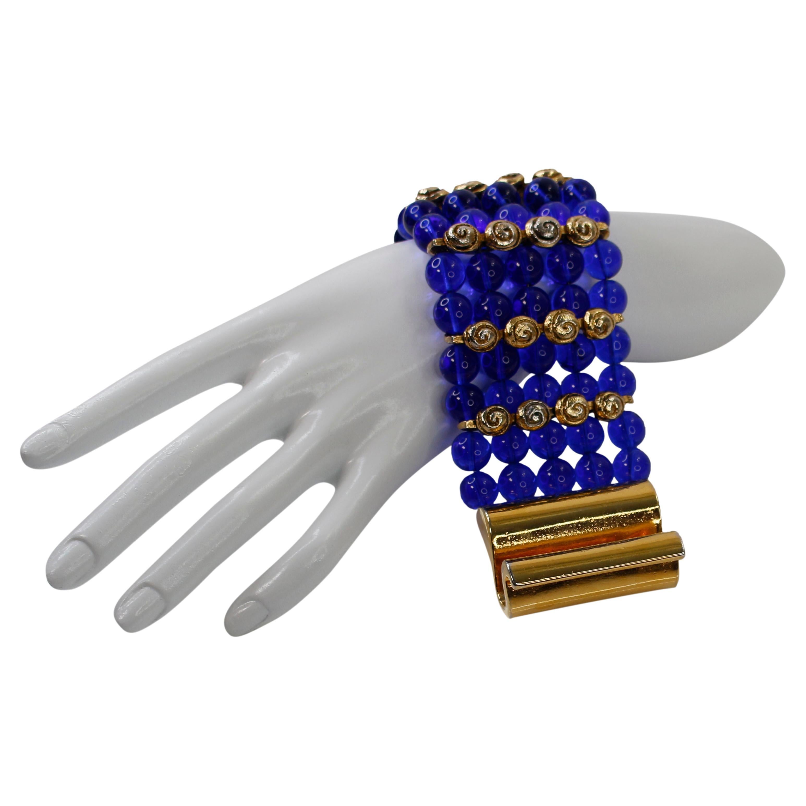 Vintage Claire Deve Gold and Blue Glass Beaded Bracelet. Wide and heavy with Unusual Closure. Bars Of Round Swirl Designs Every Two Rows. 2.5